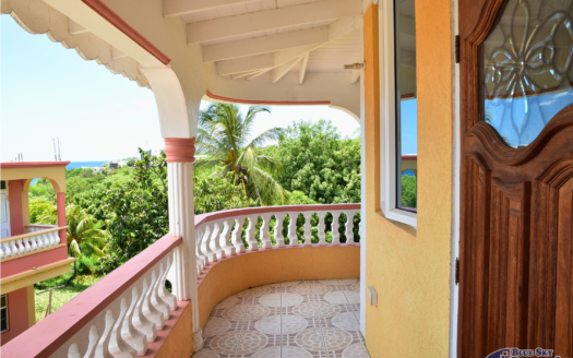 GRAND SAVANNE –TWO STOREY HOME ON 7,009 SQUARE FEET OF LAND WITH SEA AND MOUNTAIN VIEWS